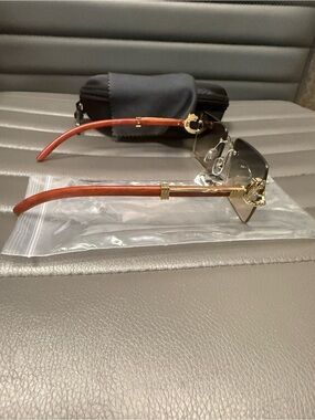Rimless Gold Frame Sunglasses with Brown Temples